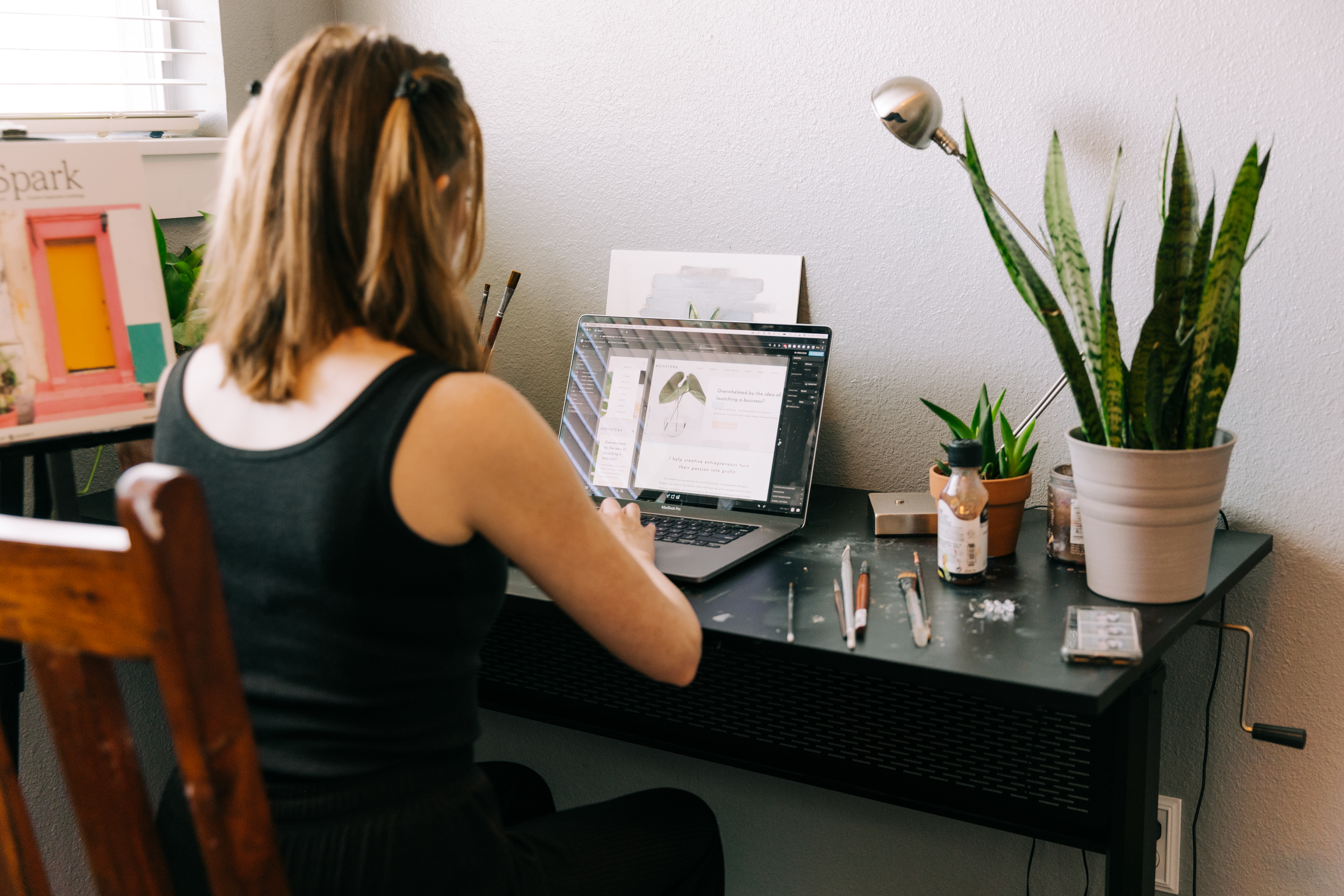 Female Website Designer Working on a Showit Website