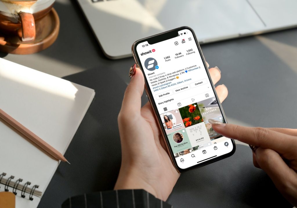 Person on Showit's Instagram viw their phone.