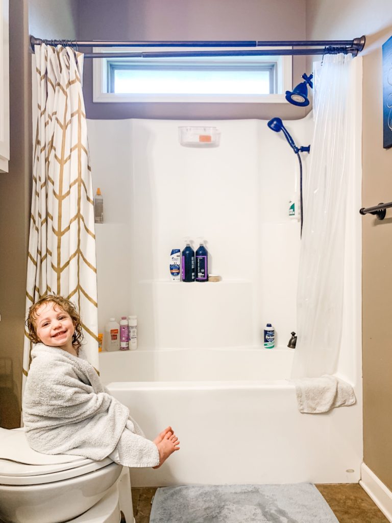 little girl in towel after her bath wrapped in a towel